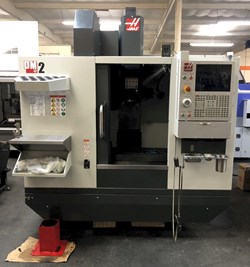 Haas DM-2 CNC Drill/Mill Machining Center 2019 equipped with 15K RPM, Thru-Spindle Coolant, 4" Axis Drive and Wiring, Wireless Probing System, Chip Auger, Programmable Coolant Nozzle, High-Speed Machi