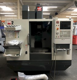 Haas DM-2 CNC Drill/Mill Machining Center 2019 equipped with 15K RPM, Thru-Spindle Coolant, 4" Axis Drive and Wiring, Wireless Probing System, Chip Auger, Programmable Coolant Nozzle, High-Speed Machi