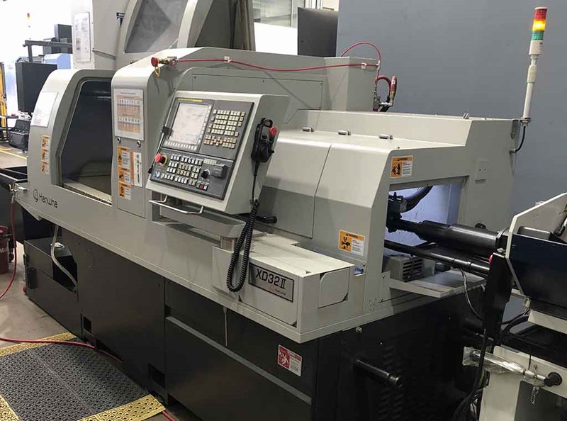 Hanwha XD32II CNC Lathe with Feeder | pressXchange